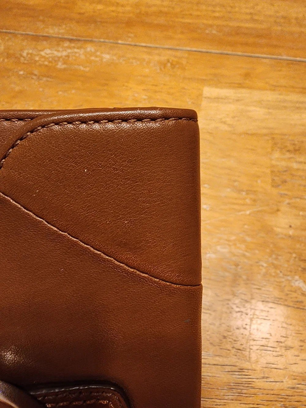 vintage Coach Soho Buckle Wallet crafted in brown leather prominent front Buckle